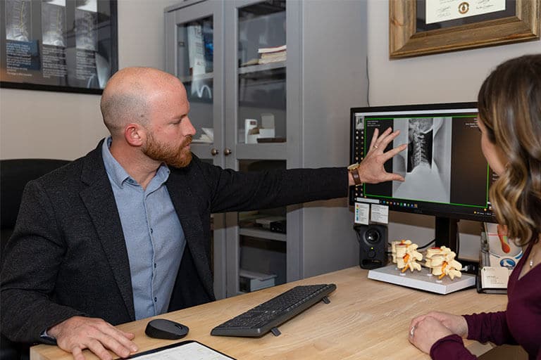 Dr. Jon with the patient discussing on X-ray